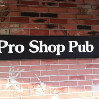 Pro Shop Pub - a sign on a brick wall - Gay Bars Near Me - Clearwater, Florida