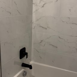The final result  Moe was able to get my the beautiful black shower head, the exact tiles I wanted and a square tub.