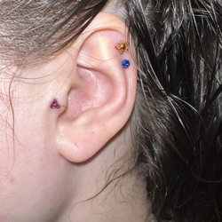 23rd Street Body Piercing - Double Helix Piercing and Tragus Piercing Jewelry: Tragus- 18g Trinity Upper Helix- 18g Flower Lower Helix- 18g Gem