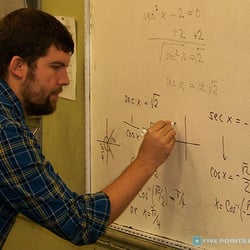 Five Points Learning Park Slope - Math tutor, Mr. Eli, solving a math problem.