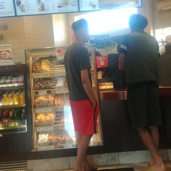 Tim Hortons - a man and a woman standing in front of the counter - Coffee & Tea Near Me - Surrey, British Columbia Tim Hortons - a man and a woman standing in front of the counter - Coffee & Tea Near Me - Surrey, British Columbia