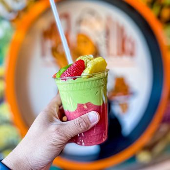 Mr Luko - a hand holding a cup of fruit smoothie - Coffee & Tea Near Me - Ottawa, Ontario
