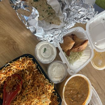 Royal Indian Curry House - butter garlic nun and Chicken Biryani, samosas and tikka masala - Indian Near Me - Long Beach, California