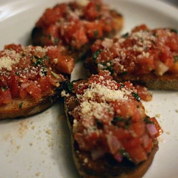 Buona Terra - Bruschetta Toscana: Marinated tomatoes and olives with olive oil and fresh herbs served on toasted garlic bread - Italian Near Me - Chicago, Illinois