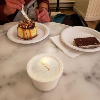 Magnolia Bakery - Small banana pudding in front, German chocolate cheesecake, and peanut butter chocolate bar of some kind (clockwise) - Bakeries Near Me - Chicago, Illinois