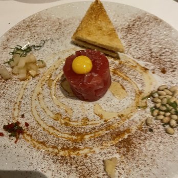 Michael Mina - Tuna Tartare with components of quail egg yolk, pear, pine nuts, chili flakes, sesame hotel. - New American Near Me - Las Vegas, Nevada Michael Mina - Tuna Tartare with components of quail egg yolk, pear, pine nuts, chili flakes, sesame hotel. - New American Near Me - Las Vegas, Nevada