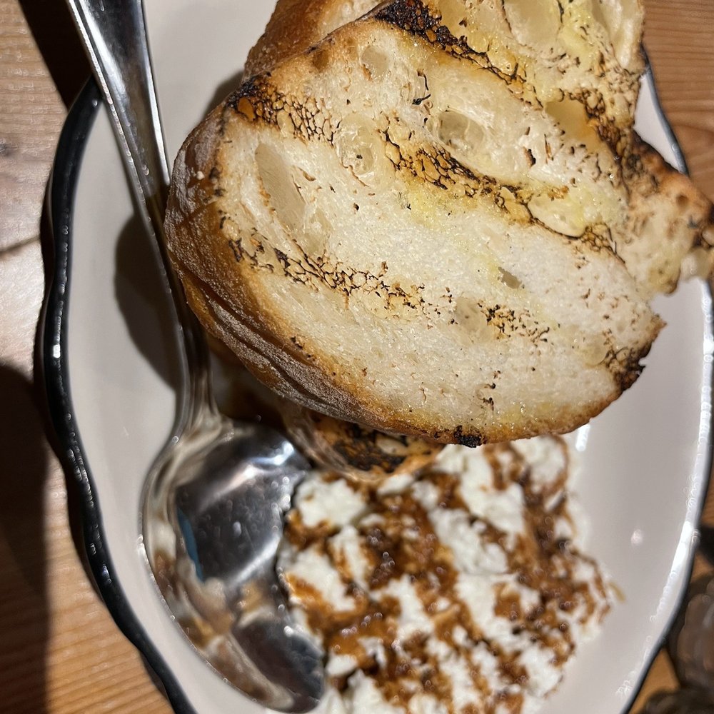 Taverna - a plate of food and a spoon - Italian Near Me - Newark, Delaware Taverna - a plate of food and a spoon - Italian Near Me - Newark, Delaware