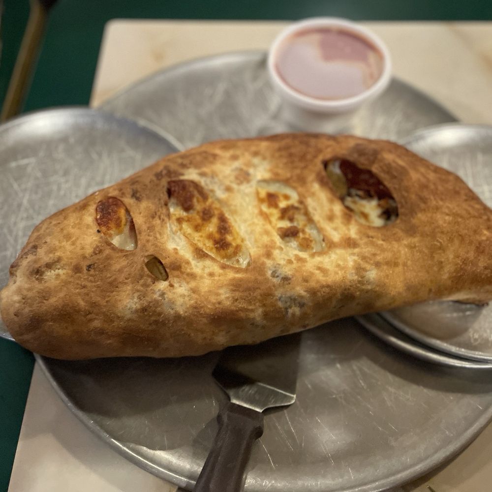Bakers Buck Hut - It looks small in this photo, but I assure you it was huge!! Calzone with bacon, sausage, and pepperoni - Pizza Near Me - New Brighton, Pennsylvania Bakers Buck Hut - It looks small in this photo, but I assure you it was huge!! Calzone with bacon, sausage, and pepperoni - Pizza Near Me - New Brighton, Pennsylvania