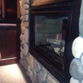 The Forum - One double sided fireplace a booth is on the other side! - Cocktail Bars Near Me - Tacoma, Washington The Forum - One double sided fireplace a booth is on the other side! - Cocktail Bars Near Me - Tacoma, Washington