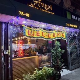 Exterior outside entrance of Angel Indian Restaurant - Night time Angel - Jackson Heights, New York Exterior outside entrance of Angel Indian Restaurant - Night time Angel - Jackson Heights, New York