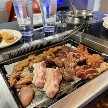 Volcano Hot Pot - Mix of raw meats and seafood on the bbq grill top. - Hot Pot Near Me - NORTH WALES, Pennsylvania Volcano Hot Pot - Mix of raw meats and seafood on the bbq grill top. - Hot Pot Near Me - NORTH WALES, Pennsylvania