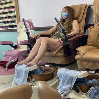 Elegant Nails & Spa - My daughter enjoying the massage chair. - Nail Salons Near Me - Lakeland, Florida