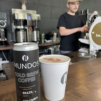 Mundos 305 - Nick is getting a vanilla latte ready for me at Mundos on Front Street in Traverse City. - Coffee & Tea Near Me - Traverse City, Michigan Mundos 305 - Nick is getting a vanilla latte ready for me at Mundos on Front Street in Traverse City. - Coffee & Tea Near Me - Traverse City, Michigan