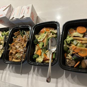 Andaman Thai - Vegetarian dishes: Tofu clay pot, pad see ew with tofu and veggies, veggie lovers, ginger eggplant. Boxed rice as well behind the dishes. - Thai Near Me - Walnut Creek, California