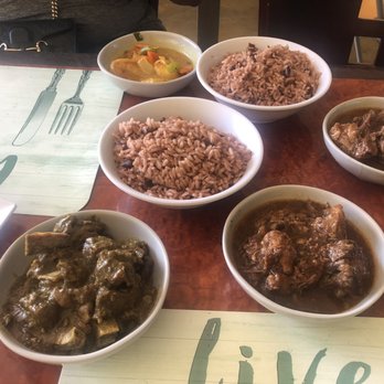 Yardy Kitchen - Left to right. Goat curry. Oxtails. Red beans and rice. And shrimp curry. - Caribbean Near Me - Norcross, Georgia Yardy Kitchen - Left to right. Goat curry. Oxtails. Red beans and rice. And shrimp curry. - Caribbean Near Me - Norcross, Georgia