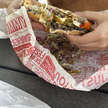 Fox's Pizza Den - a person eating a sandwich - Pizza Near Me - Wellsboro, Pennsylvania Fox's Pizza Den - a person eating a sandwich - Pizza Near Me - Wellsboro, Pennsylvania