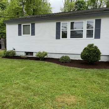 Foy Landscaping - This photo was taken after we cleaned up the lawn from the first picture. We mowed the lawn, trimmed the hedges, and mulched the beds. - Tree Services Near Me - Bedford, Massachusetts Foy Landscaping - This photo was taken after we cleaned up the lawn from the first picture. We mowed the lawn, trimmed the hedges, and mulched the beds. - Tree Services Near Me - Bedford, Massachusetts