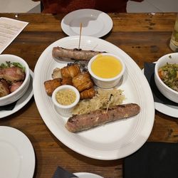 The Busted Cup - German potato salad, sausage flight appetizer and Brussels sprouts