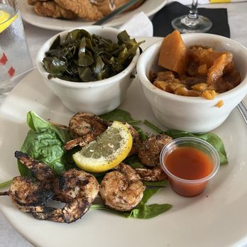 Pretty Toni's Cafe - Grilled Shrimp Skewer, sweet potatoes and collard greens. - Soul Food Near Me - Valley Stream, New York Pretty Toni's Cafe - Grilled Shrimp Skewer, sweet potatoes and collard greens. - Soul Food Near Me - Valley Stream, New York