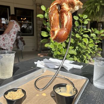 Screaming Goat Yard & Tap - Half eaten pretzel with beer cheese & mustard - Coffee & Tea Near Me - Spring Branch, Texas Screaming Goat Yard & Tap - Half eaten pretzel with beer cheese & mustard - Coffee & Tea Near Me - Spring Branch, Texas