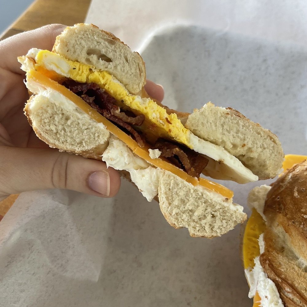 The Bagel Den - Bacon egg and cheddar cheese sandwich on a pretzel bagel. - Breakfast & Brunch Near Me - Provo, Utah The Bagel Den - Bacon egg and cheddar cheese sandwich on a pretzel bagel. - Breakfast & Brunch Near Me - Provo, Utah