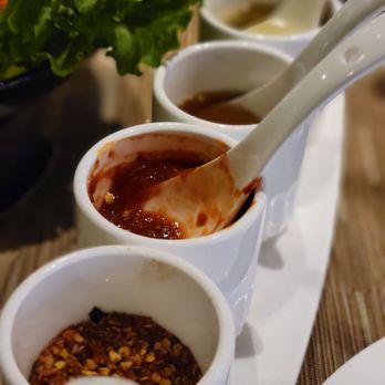 Bamboo Penny's - Condiments; Fish sauce second from the top - Thai Near Me - Leawood, Kansas