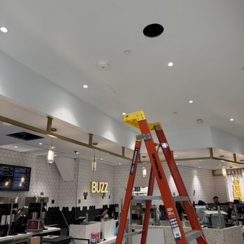Simply Wired Low Voltage - Cutting in speakers at Better Buzz in San Diego Terminal 1 project - Home Network Installation Near Me Simply Wired Low Voltage - Cutting in speakers at Better Buzz in San Diego Terminal 1 project - Home Network Installation Near Me