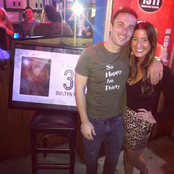 1311 - a man and a woman standing in front of a tv - Dive Bars Near Me - Pittsburgh, Pennsylvania 1311 - a man and a woman standing in front of a tv - Dive Bars Near Me - Pittsburgh, Pennsylvania