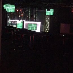 a dark room with neon lights a dark room with neon lights