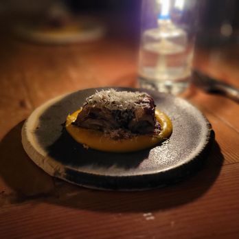 Burdock & Co - a plate of food on a wooden table - Tapas/Small Plates Near Me - Vancouver, British Columbia