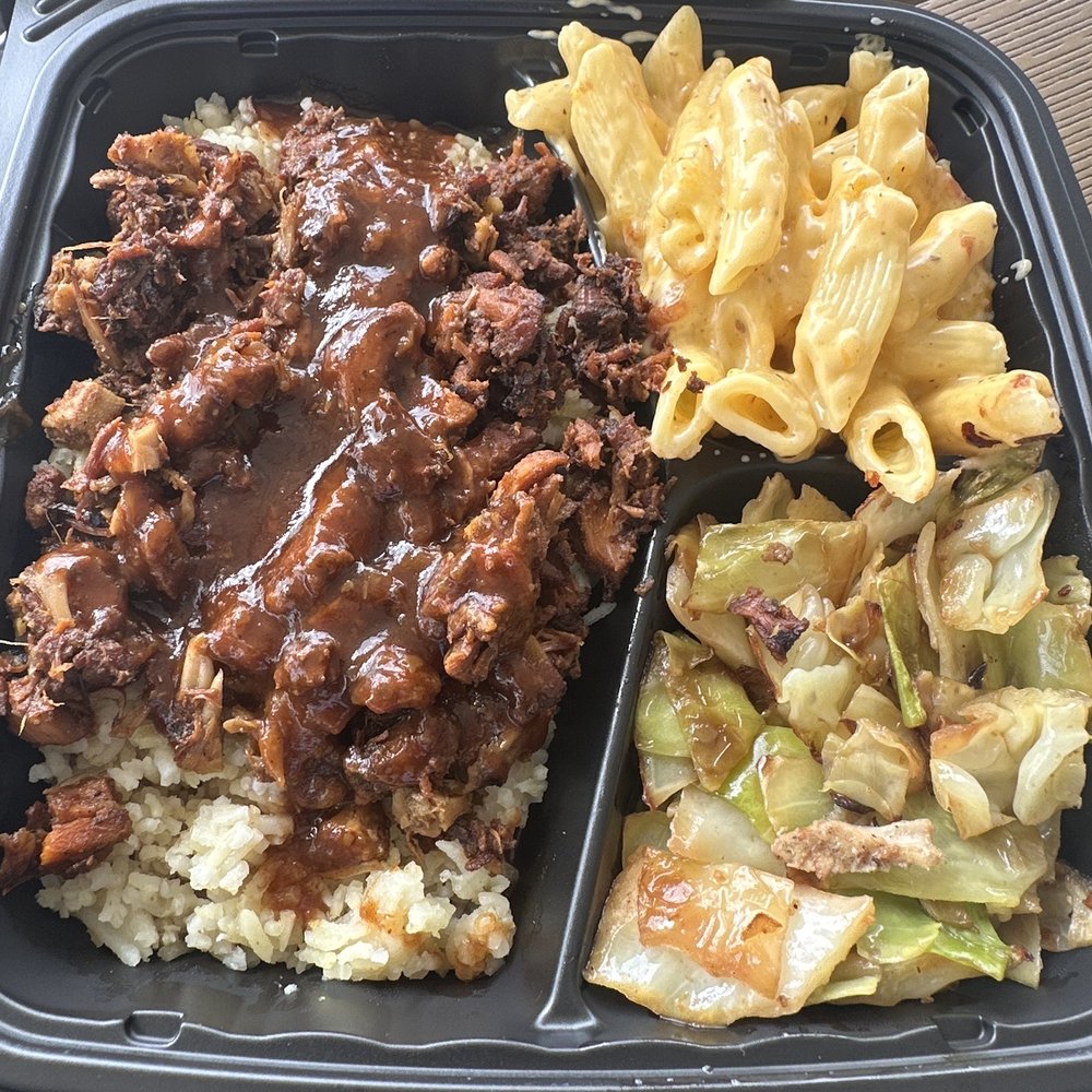 Traphouse Caribbean - a tray of food - Caribbean Near Me - Austin, Texas Traphouse Caribbean - a tray of food - Caribbean Near Me - Austin, Texas