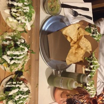 M Cantina - Surf and turf tacos on my side, chips, guacamole, and steak fajita on the other side - Mexican Near Me - Dearborn, Michigan