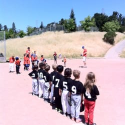 Los Perales Elementary School - Oh say can you see, by the dawn's early light,...the national anthem at the tee ball game.