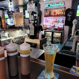 The bar with some chicken wing sauce The bar with some chicken wing sauce