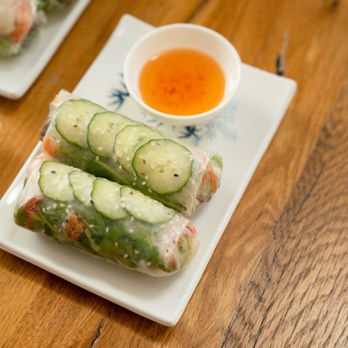 Bamboozle Heights - a plate of spring rolls and a bowl of dipping sauce - Salad Near Me - Tampa Bay, Florida