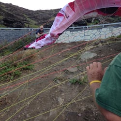 Oahu Hawaii Tandem Paragliding Flights - Just about ready for takeoff...my pilot, Jorge, and two helpers spread the paraglider wing and ensure the lines are tangle-free.