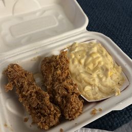 Two chicken tenders and a side of mac and cheese Two chicken tenders and a side of mac and cheese