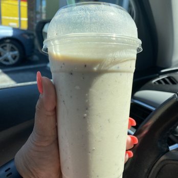 Impact Nutrition - a hand holding a drink in a plastic cup - Specialty Food Near Me - Wilmington, North Carolina Impact Nutrition - a hand holding a drink in a plastic cup - Specialty Food Near Me - Wilmington, North Carolina