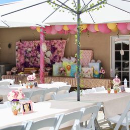 Umbrellas, rectangular table, padded white chairs