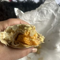 El Delicioso Burrito - Not a great sausage breakfast burrito. Weird cheese clumpvery little sausage.