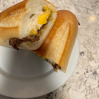 Main Street Submarines - a half eaten sandwich on a plate - Sandwiches Near Me - Madison, New Jersey