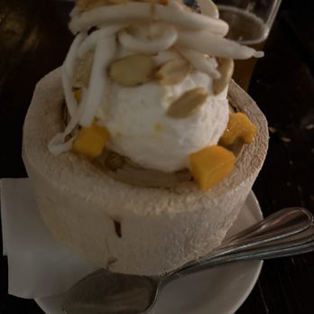 Pai Northern Thai Kitchen - Coconut Sorbet with mango, peanuts and fresh shaved coconut -- in a coconut! - Thai Near Me - Toronto, Ontario Pai Northern Thai Kitchen - Coconut Sorbet with mango, peanuts and fresh shaved coconut -- in a coconut! - Thai Near Me - Toronto, Ontario