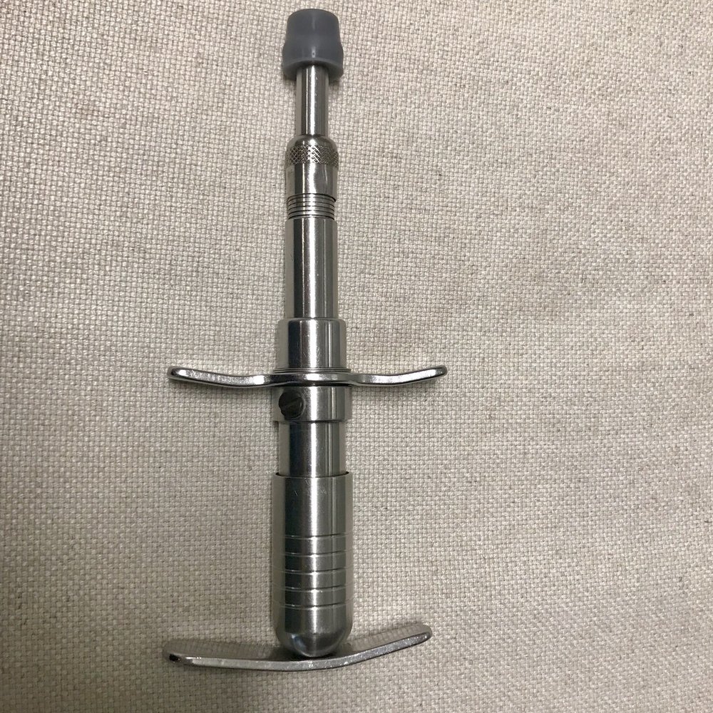 Optilife Chiropractic - Activator adjustment tool which helps to realign vertebrae. - Chiropractors Near Me - Tampa, Florida