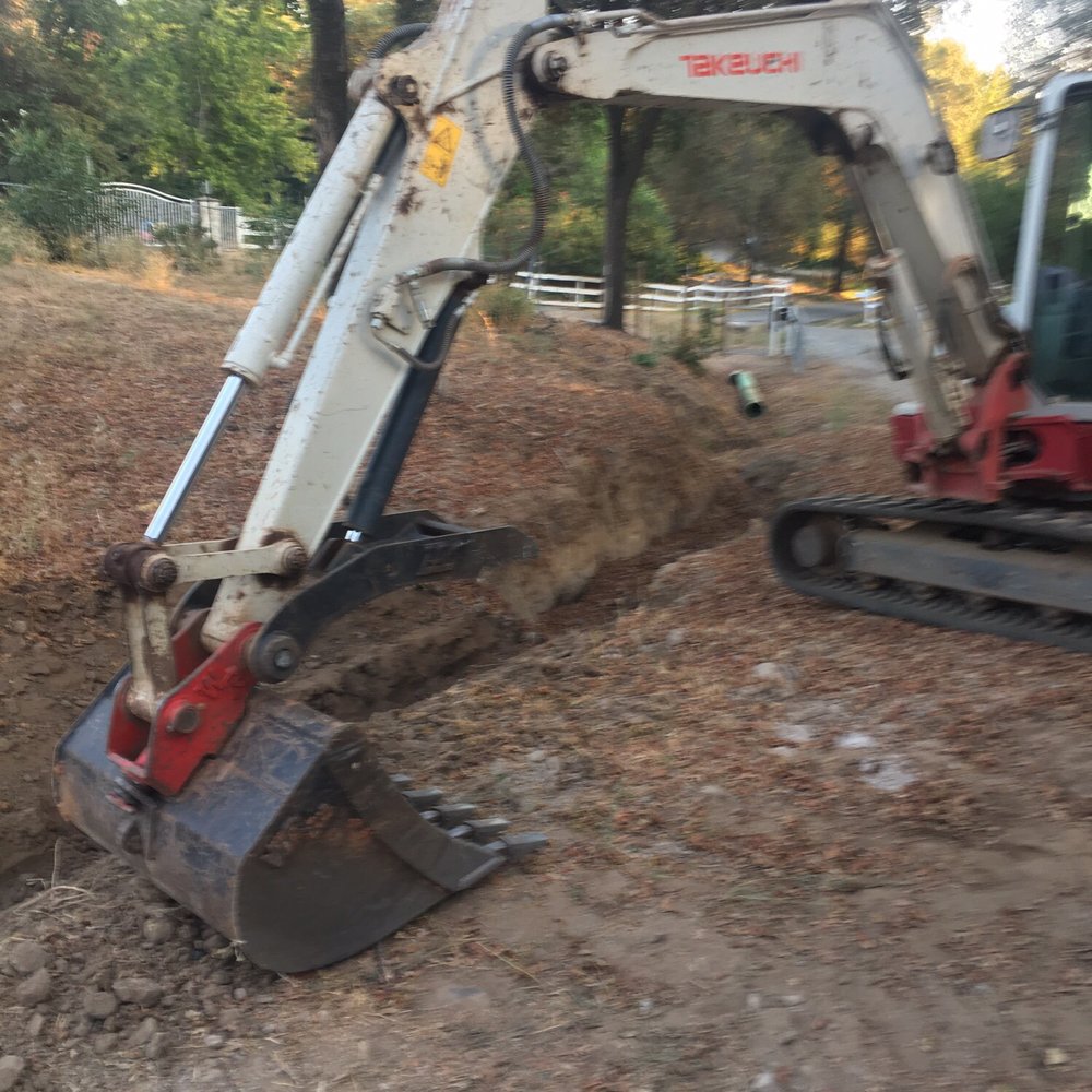 Beginning to clean out the eroding ravine. Beginning to clean out the eroding ravine.