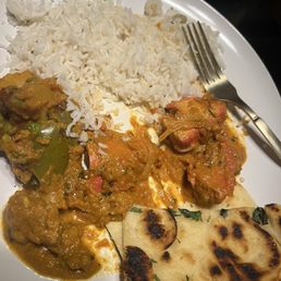 Rice , butter chicken, vegetables korma , tikka masala and garlic naan Rice , butter chicken, vegetables korma , tikka masala and garlic naan
