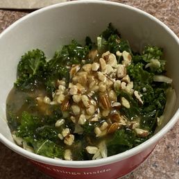 Kale salad with nuts and apple cider vinegar dressing.