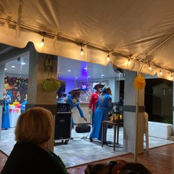 Hermanos Mora Arriaga - Mexican Show Band Miami - Mariachis Miam - The band picking up their equipment while they socialize with the birthday boy. Awesome tunes and time!