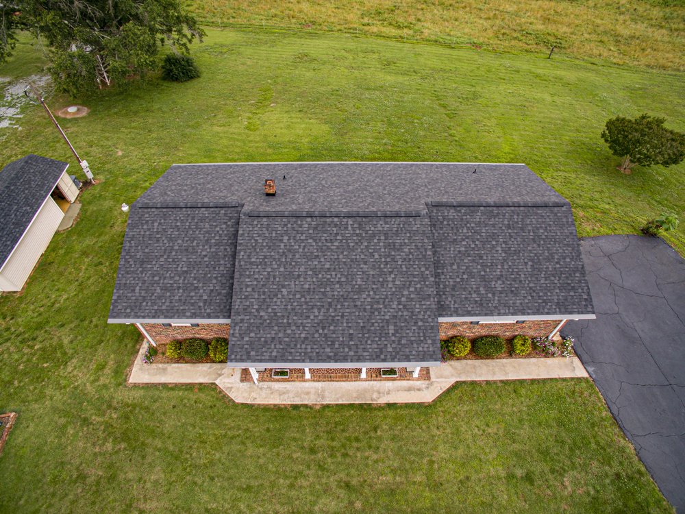 Slide of Guy Roofing