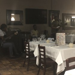 Le Coq Noir - Main seating area with live band playing