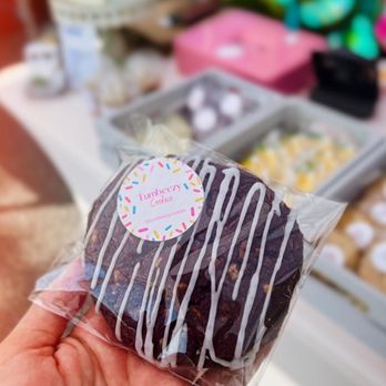 Tumbeezy Cookies - a hand holding a chocolate donut - Desserts Near Me - Virginia Beach, Virginia